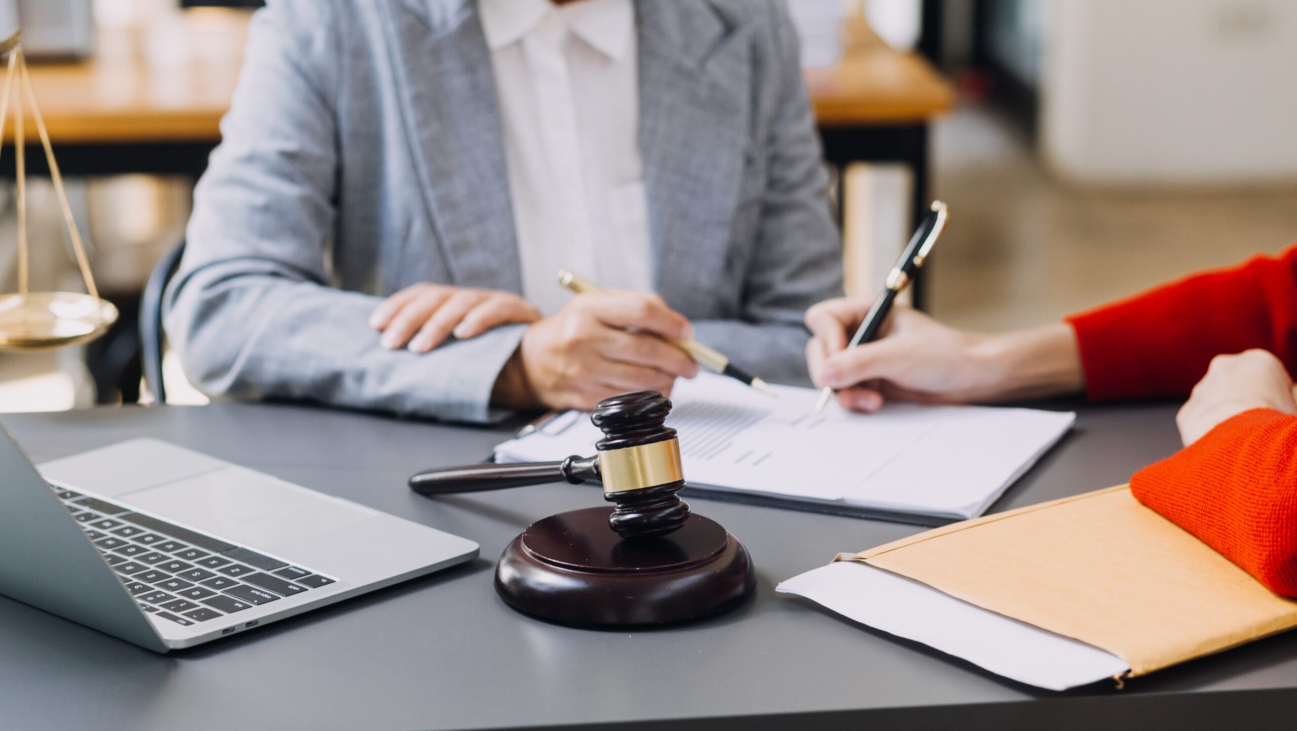 Image of a landlord and her attorney post-judgement collection